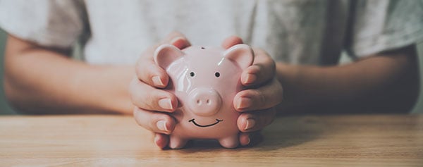 person holding piggy bank related post image