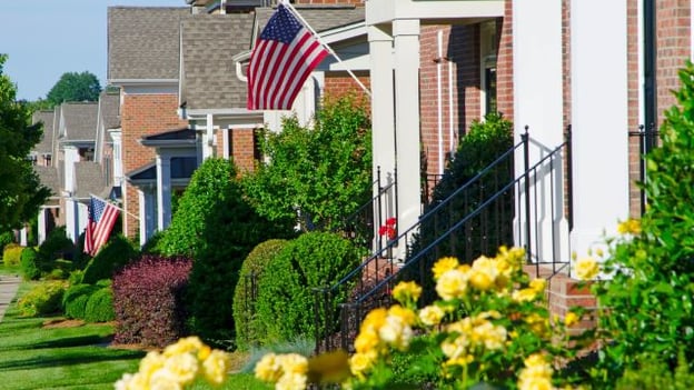 flag flying in porch of home in suburban HOA related post image