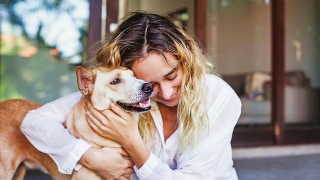 woman in HOA community hugging dog related post image