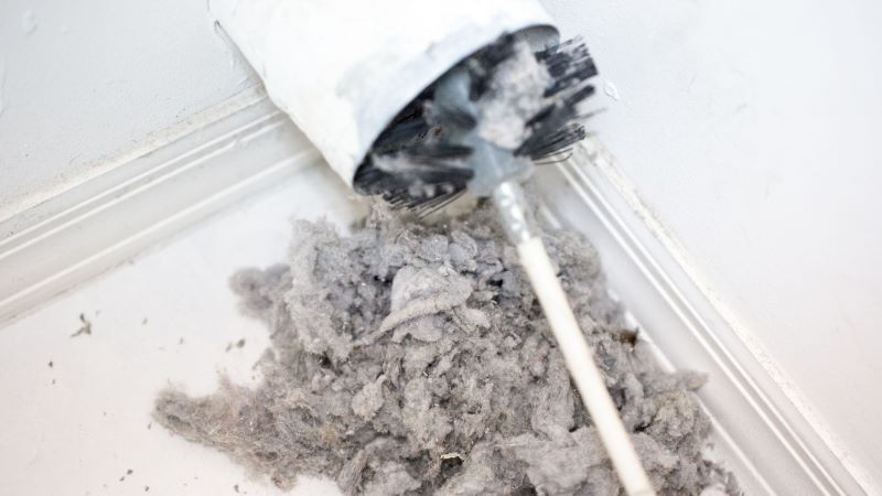 lint being removed from dirty dryer vent