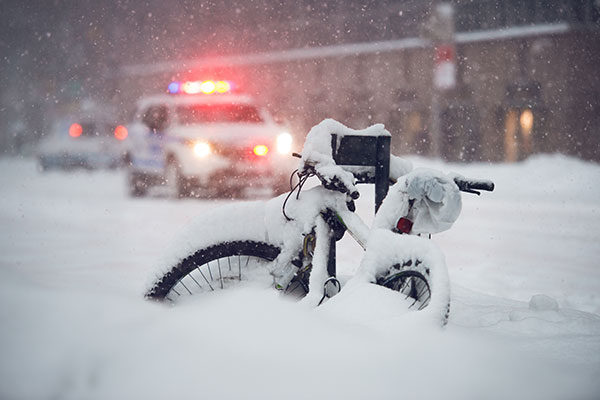 Bike covered in snow during snow storm blog image