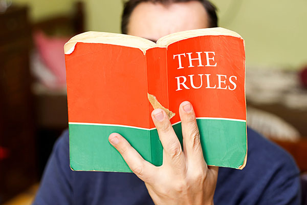 person holding rule book
