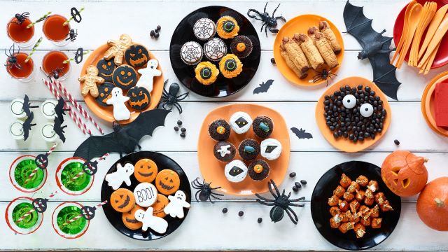 table full of halloween themed treats